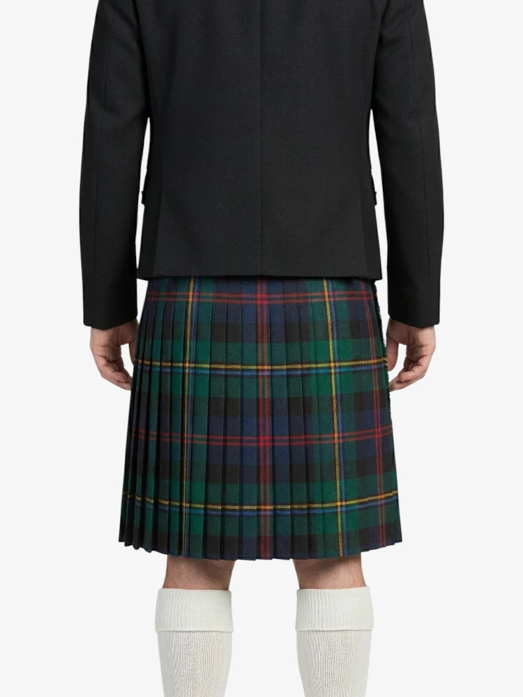 Person wearing a black jacket and plaid kilt on a white background