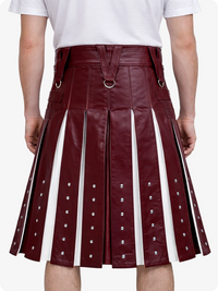 Maroon leather skirt with white accents worn by a person on a white background