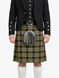 Person wearing a traditional Scottish kilt with a jacket on a white background