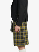 Person wearing a black jacket  and a yellow plaid kilt on a white background