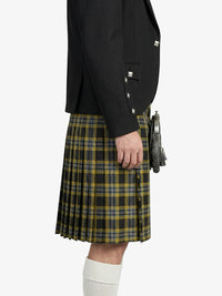 Person wearing a black jacket and plaid kilt on a white background