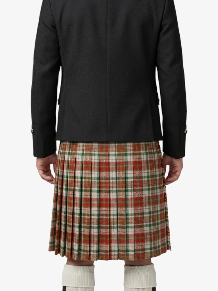 Person wearing a black jacket and plaid kilt on a white background
