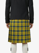 Person wearing a yellow plaid kilt with a black jacket on a white background