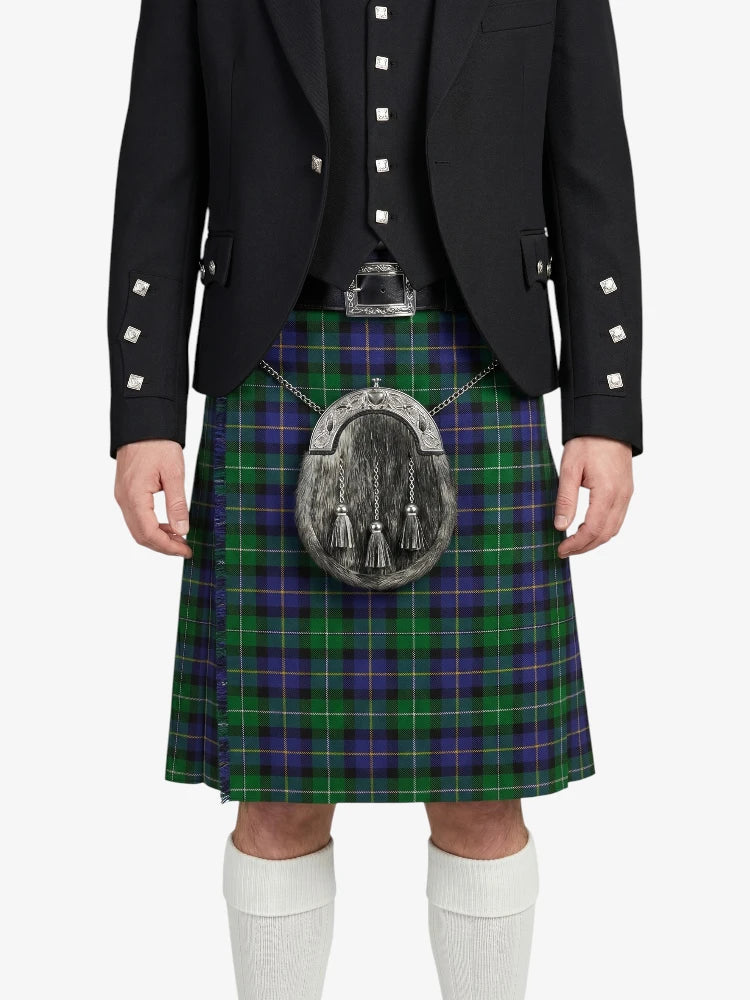 Person wearing a black jacket and green plaid kilt with a silver sporran on a white background
