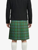 Person wearing a black jacket and green plaid kilt on a white background