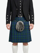 Person wearing a dark jacket and green plaid kilt with a silver sporran on a white background
