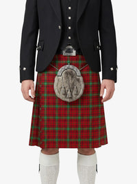 Person wearing a red tartan kilt with a black jacket and white socks on a white background