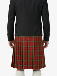 Person wearing a black jacket and red plaid kilt on a white background