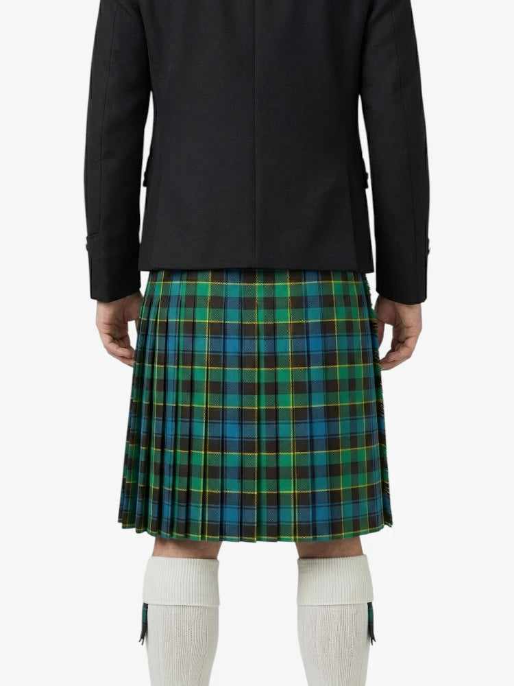 Person wearing a black jacket and green plaid kilt on a white background