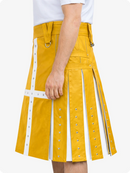 Yellow kilt with white accents worn by a person on a white background