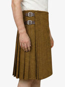 Brown pleated kilt with belt on a white background
