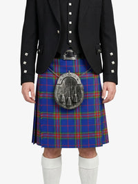 Person wearing a black jacket and blue plaid kilt with a sporran on a white background