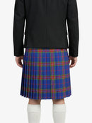 Person wearing a black jacket and blue plaid kilt on a white background