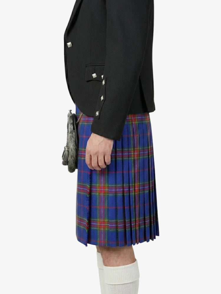 Person wearing a black jacket and blue plaid kilt on a white background
