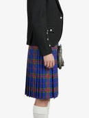 Person wearing a black jacket and blue plaid kilt on a white background