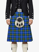 Person wearing a traditional Scottish kilt with a tartan pattern on a white background