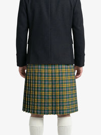Person wearing a black coat and green plaid kilt on a white background