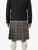 Person wearing a black jacket and plaid kilt on a white background