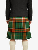 Person wearing a green plaid kilt with a black jacket on a white background
