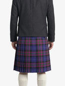 Person wearing a dark gray jacket and plaid kilt  on a white background