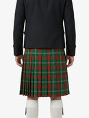 Person wearing a black coat and red plaid kilt on a white background