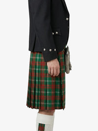 Person wearing a dark jacket and red plaid kilt on a white background