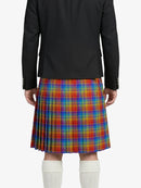 Person wearing a black jacket and colorful plaid kilt on a white background