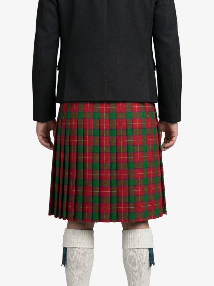 Person wearing a red plaid kilt on a white background