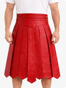 Red pleated skirt worn by a person on a white background