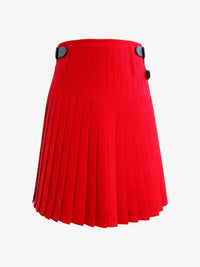 Red pleated kilt with black buttons on a white background