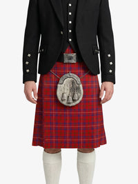 Person wearing a red tartan kilt with a black jacket on a white background