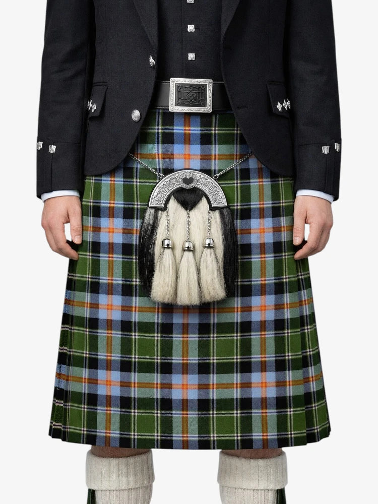 Person wearing a traditional Scottish kilt with a sporran on a white background