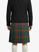Person wearing a black jacket and a plaid kilt on a white background