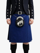 Person wearing a traditional Scottish kilt with a sporran on a white background