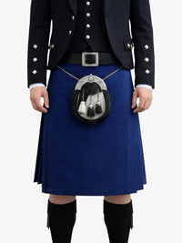Person wearing a traditional Scottish kilt with a sporran on a white background