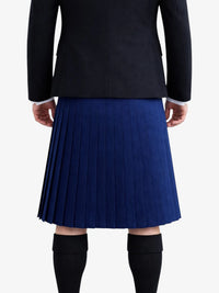 Person wearing a black jacket and blue pleated kilt on a white background