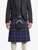 Person wearing a dark gray suit with a blue plaid kilt on a white background