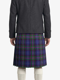Person wearing a gray jacket and blue plaid kilt on a white background
