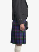 Person wearing a dark gray jacket and a blue plaid kilt on a white background