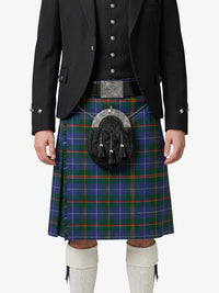 Person wearing a traditional Scottish kilt with a tartan pattern on a white background