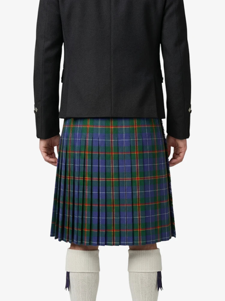 Person wearing a black jacket and blue plaid kilt on a white background