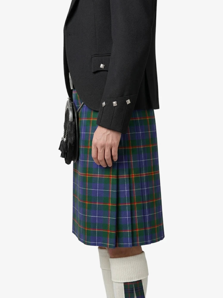 Person wearing a black jacket and plaid kilt on a white background