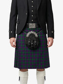 Person wearing a traditional Scottish kilt with a sporran on a white background