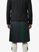 Person wearing a black jacket and a plaid kilt on a white background