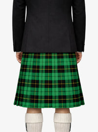 Person wearing a black jacket and green plaid kilt on a white background