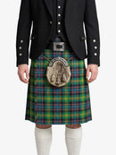 Person wearing a traditional Scottish kilt with a tartan pattern on a white background