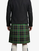 Person wearing a black jacket and green plaid kilt on a white background