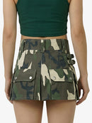 Camouflage skirt worn by a person on a white background