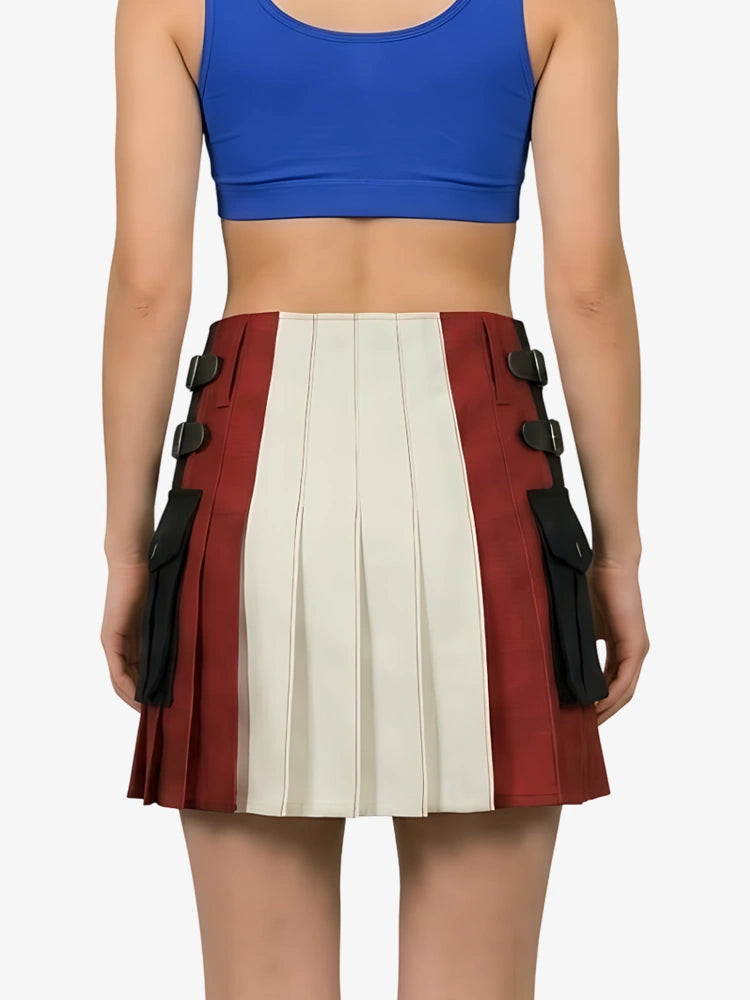 Person wearing a blue crop top and a red and white pleated skirt with black accents on a white background