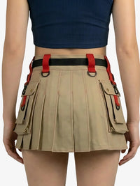 Person wearing a beige pleated skirt with tool belt and blue top on a white background